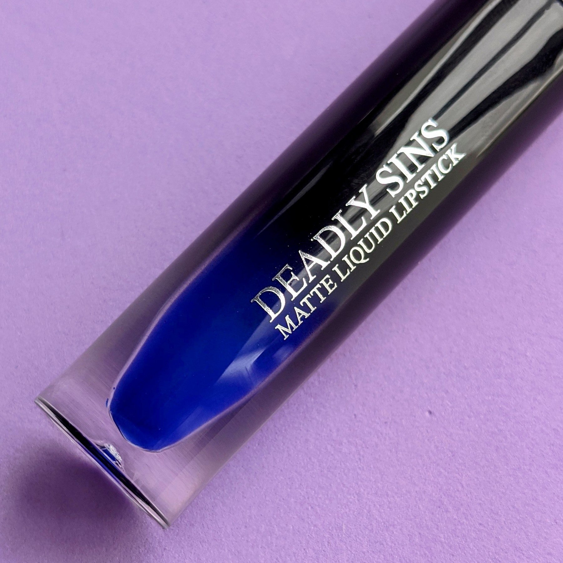 Lunar Blue Matte Liquid Lipstick Deadly Sins Cosmetics lipstick tube close up