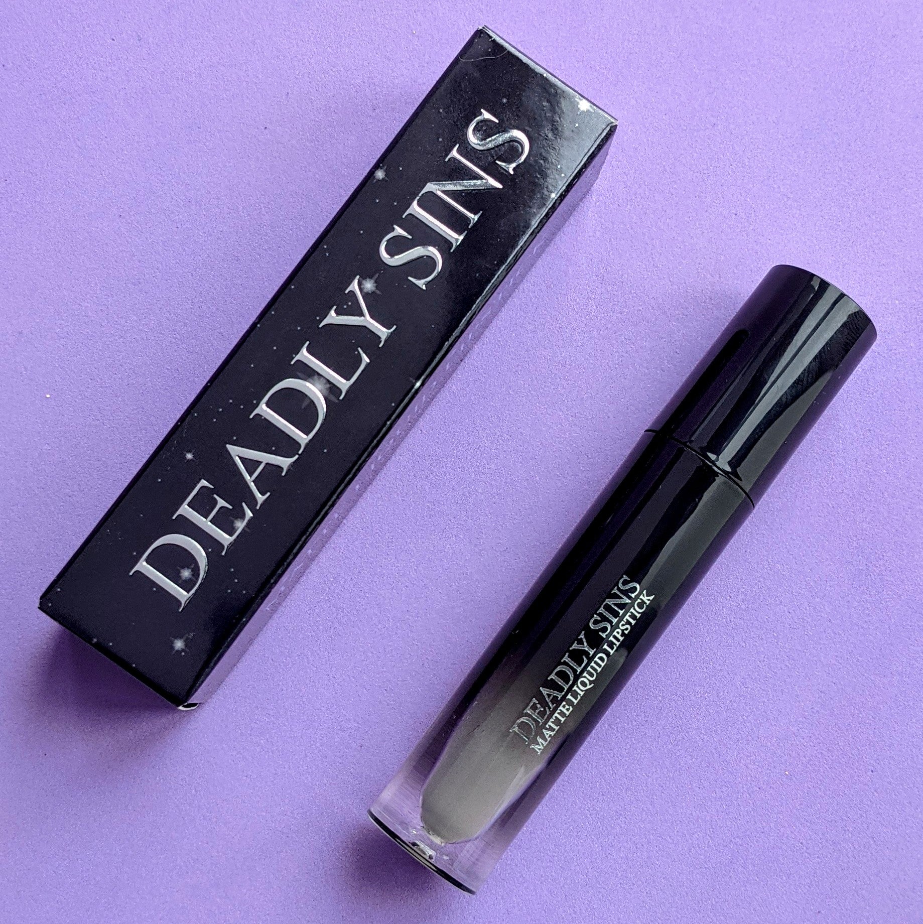 RIP grey matte liquid lipstick Deadly Sins Cosmetics Goth makeup tube and package with stars